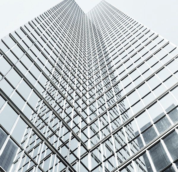 Modern glass office tower rising into the sky